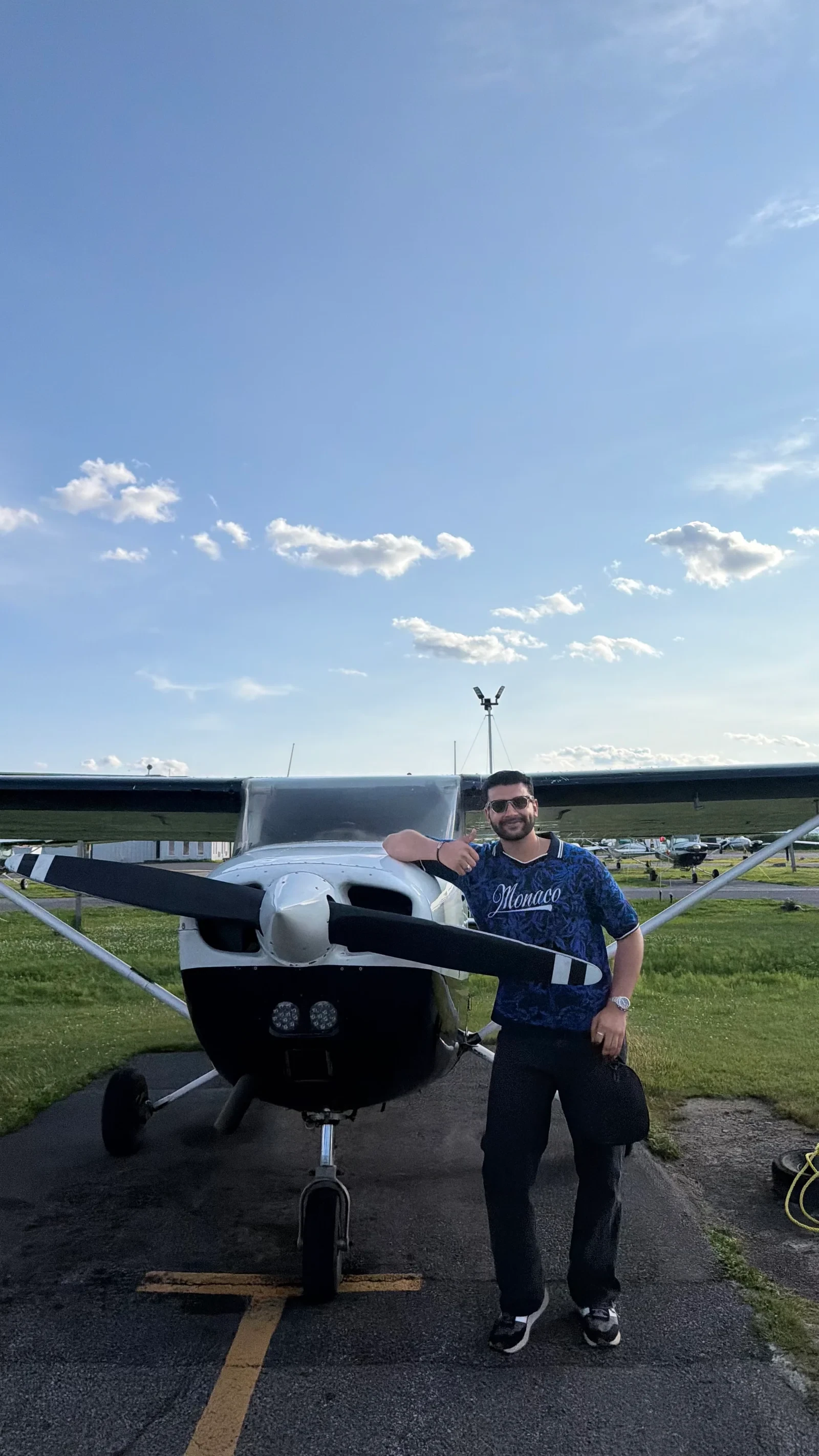 Adeel beside a small aircraft